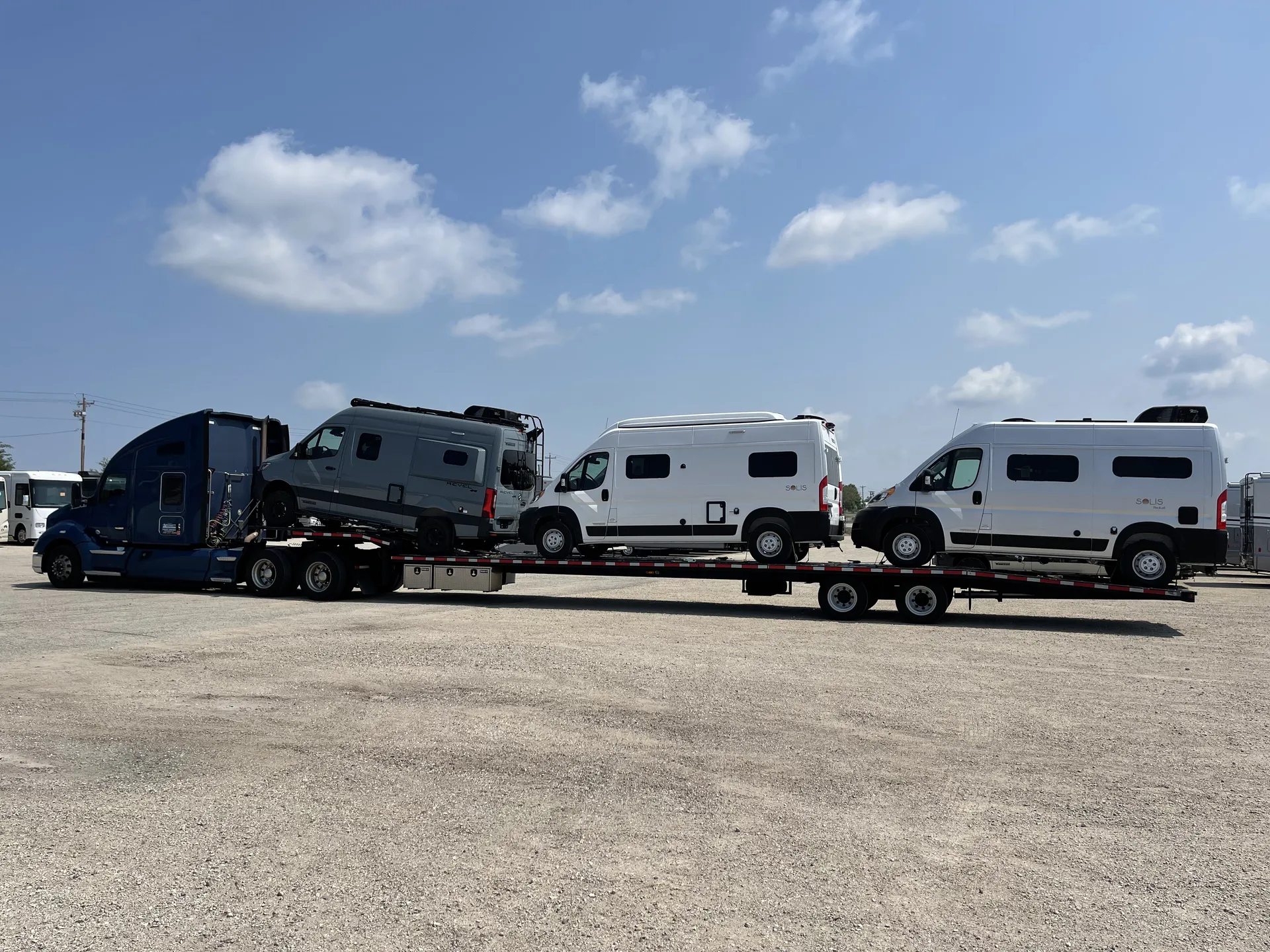 Patriot Services hauling multiple RVs on flatbed